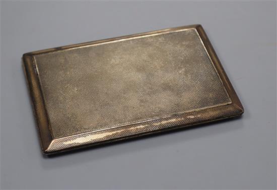 A George V silver engine turned cigarette case, 12.8cm.